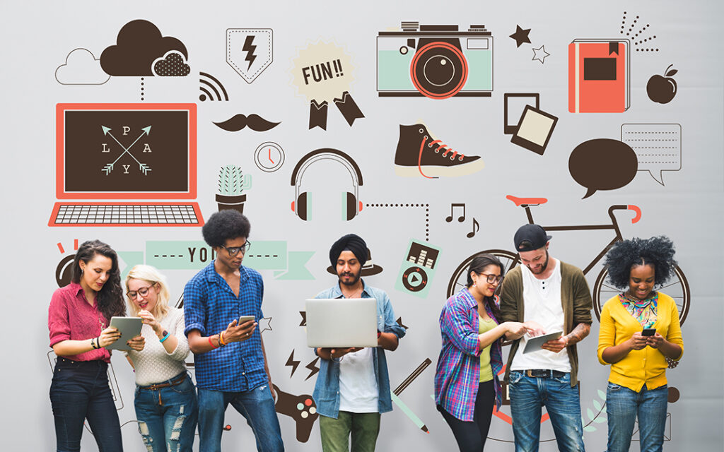 Group of Gen Z employees using digital tools to collaborate on ESG initiatives and engagement programs.